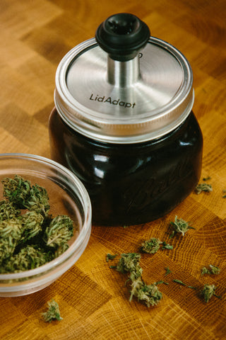 Kaug LidAdapt 2.0 featured in our Specialty Kit Small Stash with 16 oz wide mouth amber mason jar and VacuVin pump and stopper for vacuum sealing. Great for cooking with and storing cannabis.